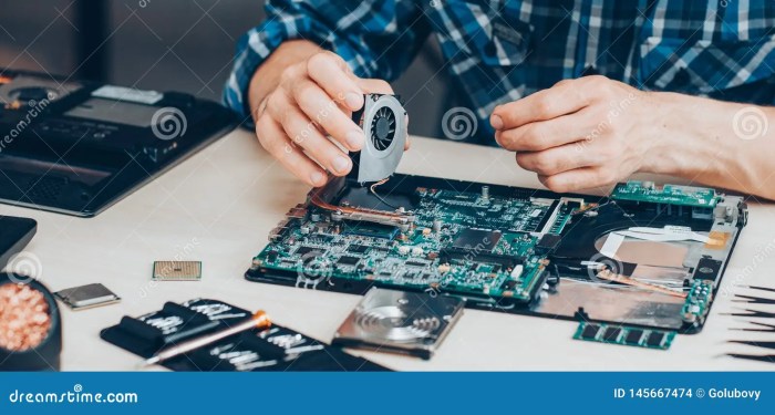 Laptop computer hardware repair support service fixing technician cooler cropped electronic technology shot stock